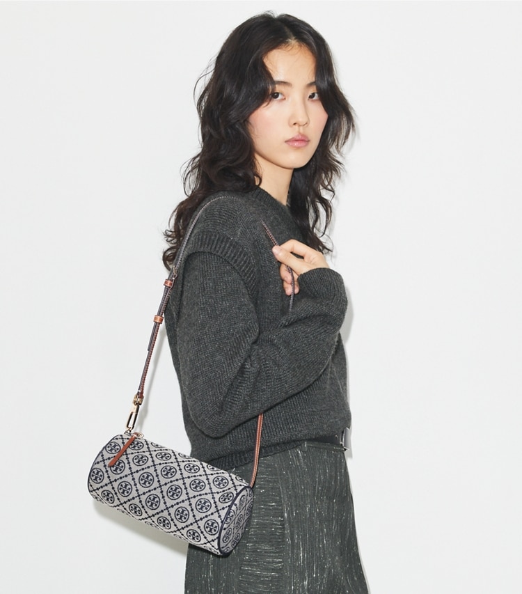 Tory Burch designer crossbody bags T Monogram Cylinder Bag in Tory Navy accessory on model