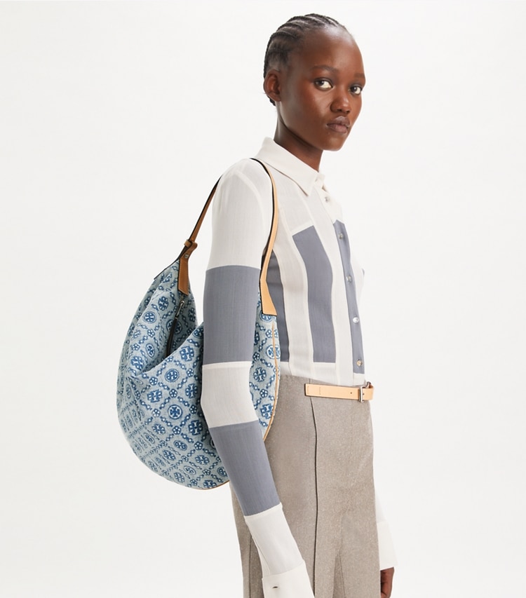 Tory Burch designer hobo bags T Monogram Denim Balloon Bag in Powder Blue accessory on model