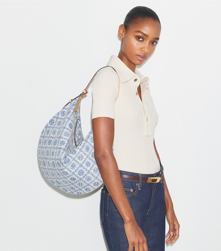 Tory Burch designer hobo bags T Monogram Denim Balloon Bag in Powder Blue accessory on model