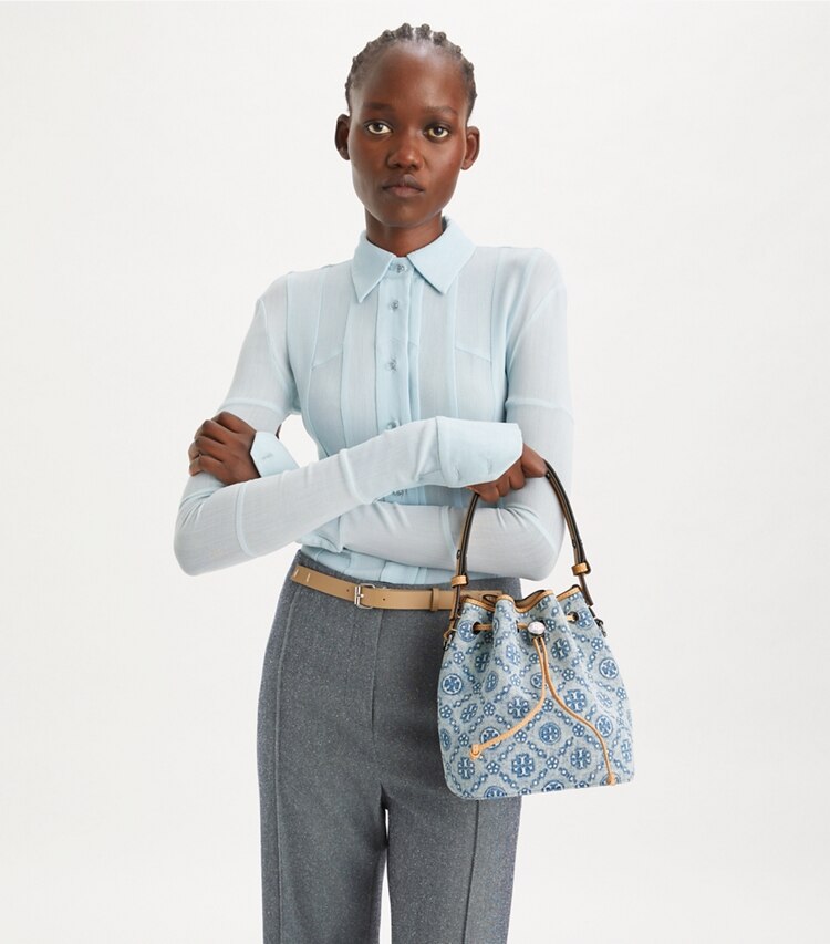 Tory Burch designer crossbody bags T Monogram Denim Bucket Bag in Powder Blue additional on model