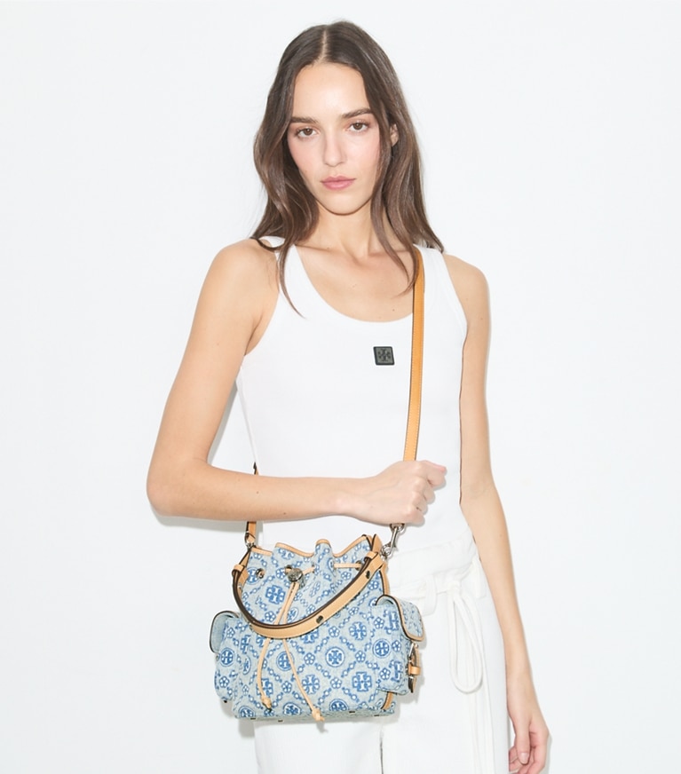 Tory Burch designer crossbody bags T Monogram Denim Bucket Bag in Powder Blue additional on model