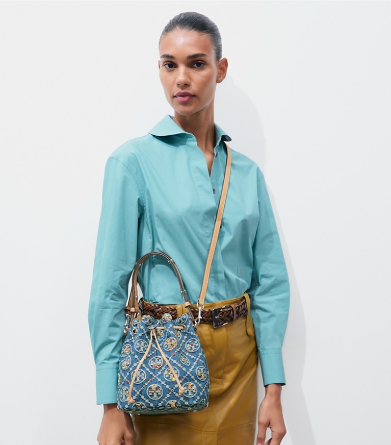 Tory Burch designer crossbody bags T Monogram Denim Embellished Bucket Bag in Deep Royal accessory on model