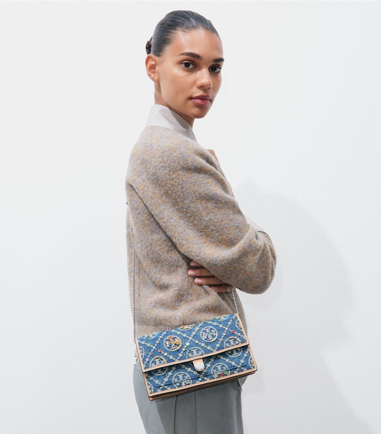 Tory Burch designer crossbody bags T Monogram Denim Embellished Wallet Crossbody in Deep Royal accessory on model