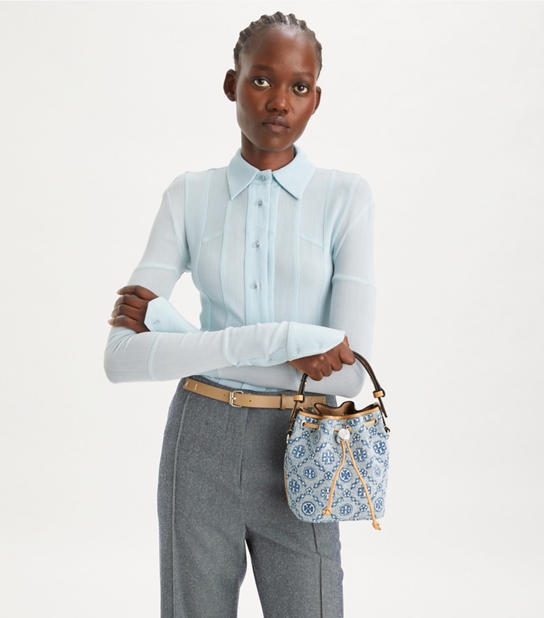 Tory Burch designer crossbody bags T Monogram Denim Mini Bucket Bag in Powder Blue angle