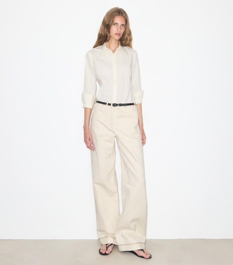 Tory Burch designer bottoms T Monogram Denim Pant in White / Ivory T Monogram on model front