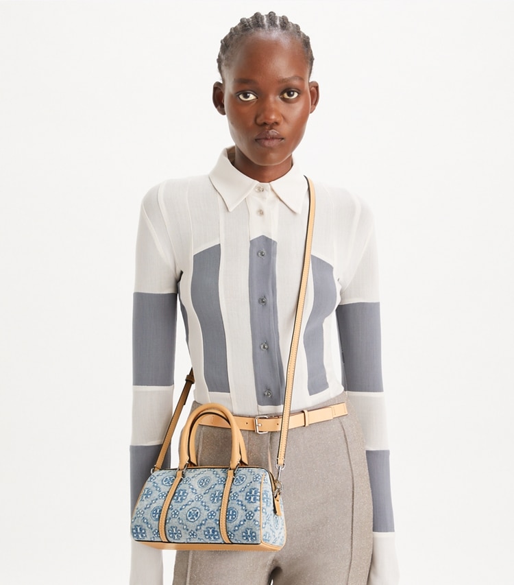 Tory Burch designer crossbody bags T Monogram Denim Petite Barrel Bag in Powder Blue accessory on model