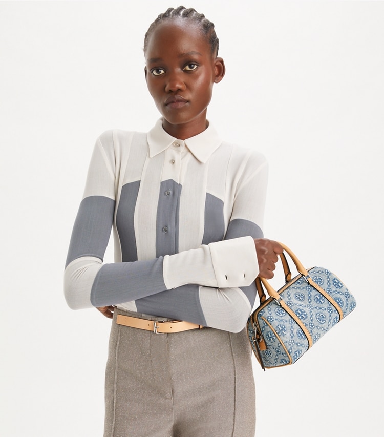 Tory Burch designer crossbody bags T Monogram Denim Petite Barrel Bag in Powder Blue additional on model