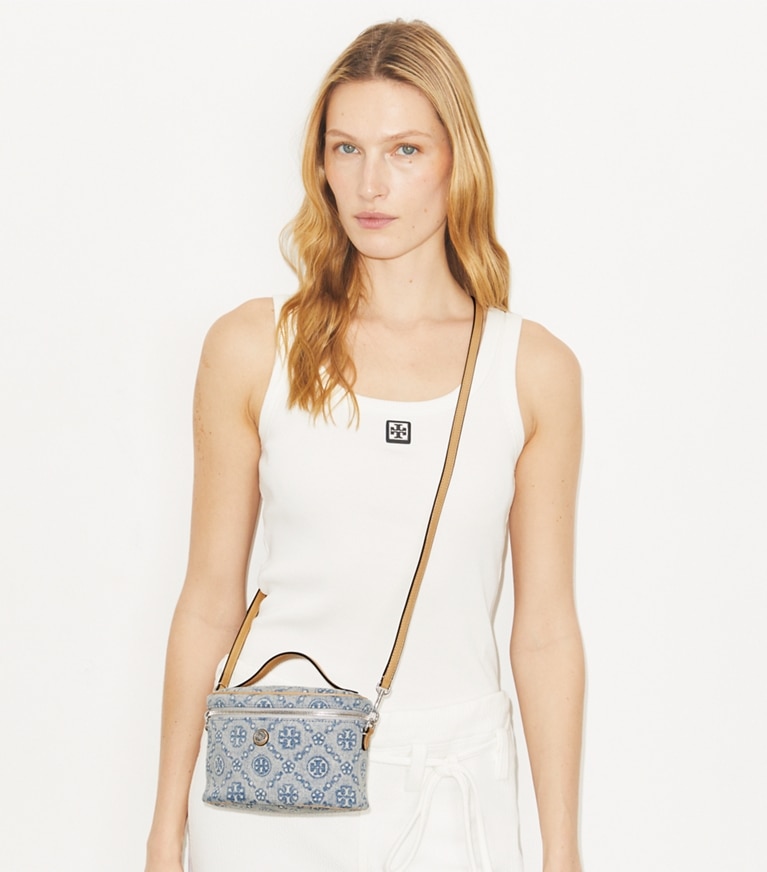 Tory Burch designer mini bags T Monogram Denim Soft Vanity Case in Powder Blue accessory on model