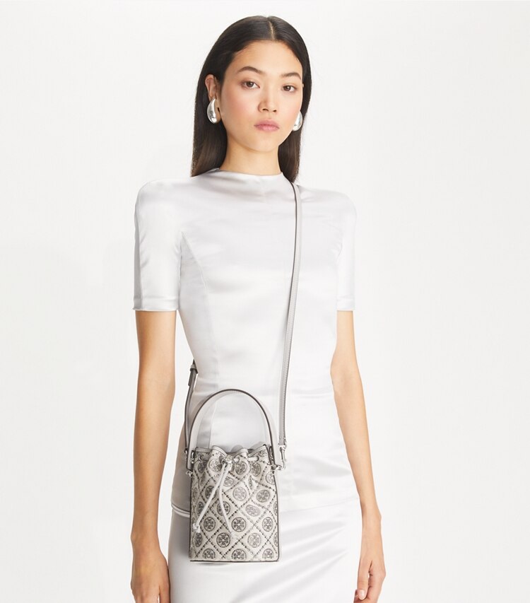 Tory Burch designer crossbody bags T Monogram Embellished Mini Bucket Bag in Gray accessory on model