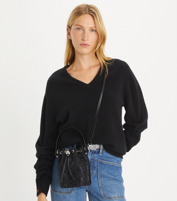 Tory Burch designer crossbody bags T Monogram Embellished Mini Bucket Bag in Black accessory on model