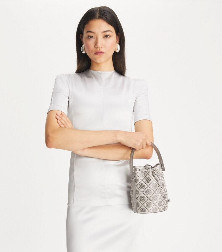 Tory Burch designer crossbody bags T Monogram Embellished Mini Bucket Bag in Gray additional on model