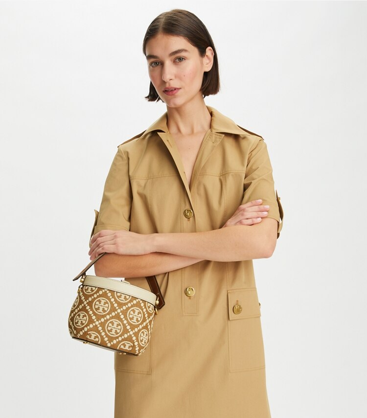 Tory Burch designer crossbody bags T Monogram Embroidered Raffia Canteen Bag in Aged Camello Mix accessory on model