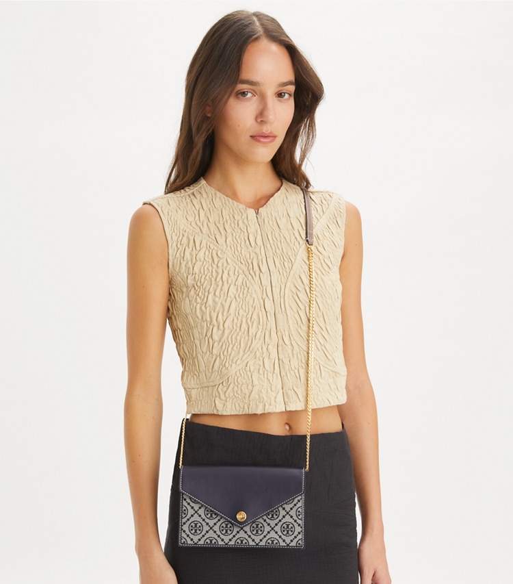 Tory Burch designer mini bags T Monogram Envelope Crossbody in Tory Navy accessory on model