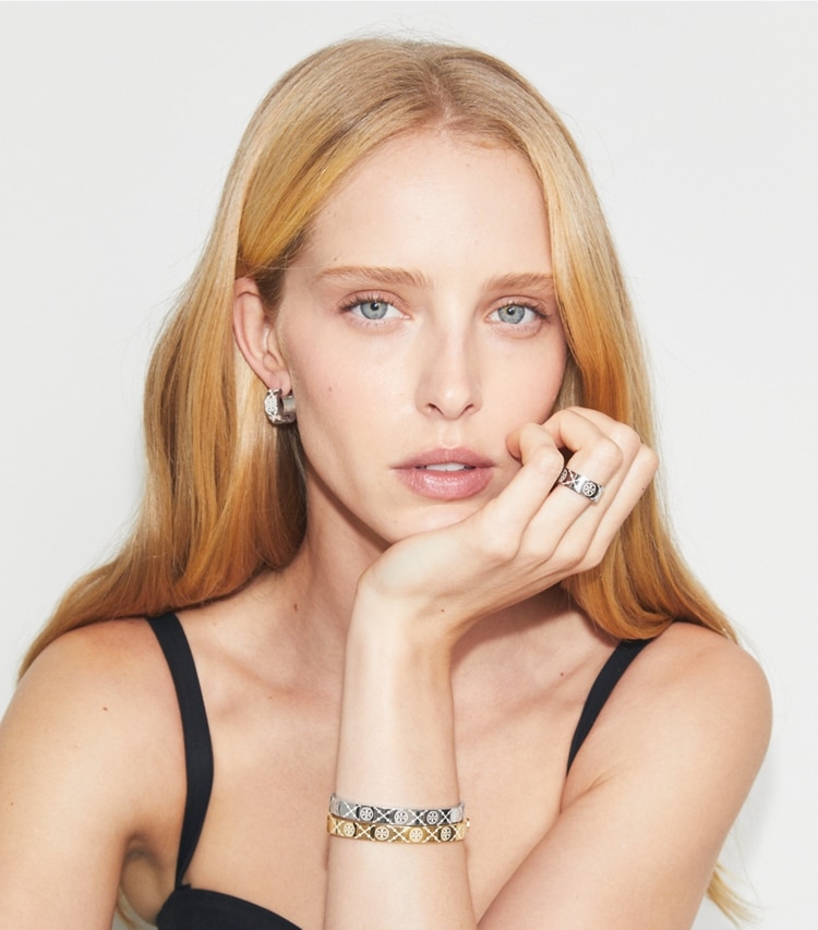 Tory Burch designer bracelets T Monogram Hinge Bracelet in Tory Gold / New Ivory accessory on model