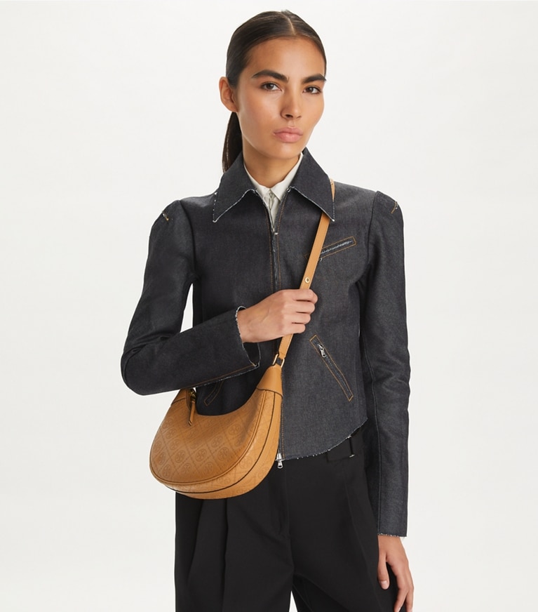 Tory Burch designer shoulder bags T Monogram Leather Crescent Bag in Tan accessory on model