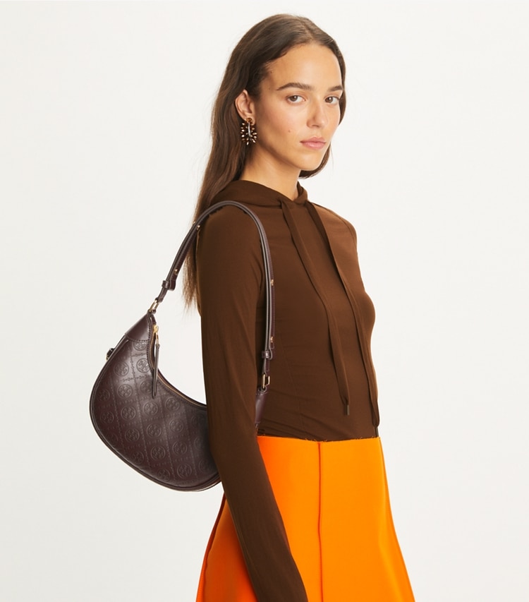 Tory Burch designer shoulder bags T Monogram Leather Crescent Bag in Deep Maroon accessory on model