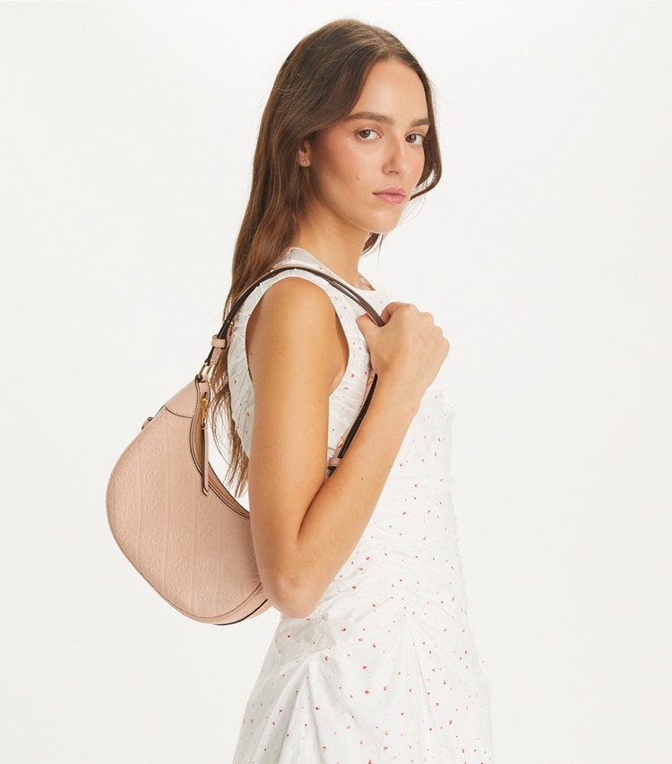 Tory Burch designer shoulder bags T Monogram Leather Crescent Bag in Blush accessory on model