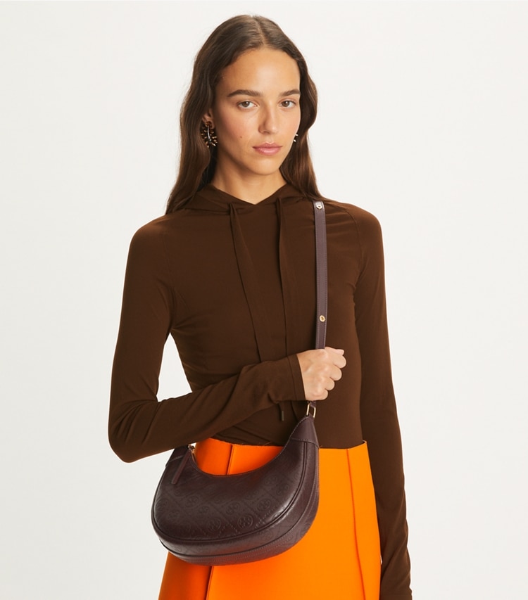 Tory Burch designer shoulder bags T Monogram Leather Crescent Bag in Deep Maroon additional on model