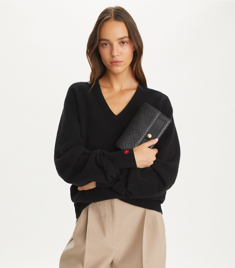 Tory Burch designer mini bags T Monogram Leather Crossbody in Black additional on model