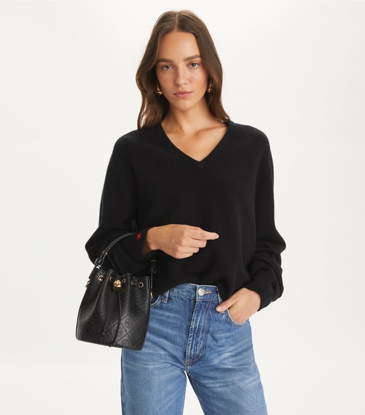 Tory Burch designer crossbody bags T Monogram Leather Mini Bucket Bag in Black additional on model