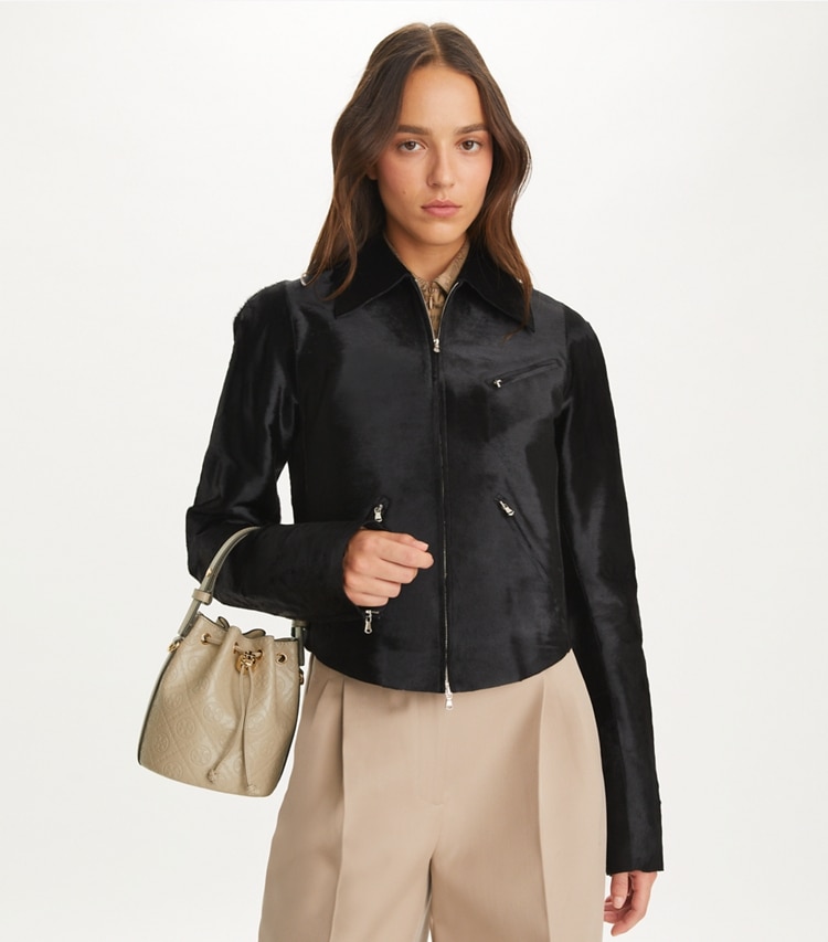 Tory Burch designer crossbody bags T Monogram Leather Mini Bucket Bag in Fresh Clay additional on model