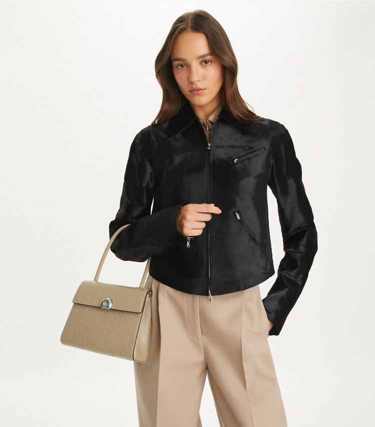 Tory Burch designer satchels T Monogram Leather Small Deville Bag in Fresh Clay accessory on model