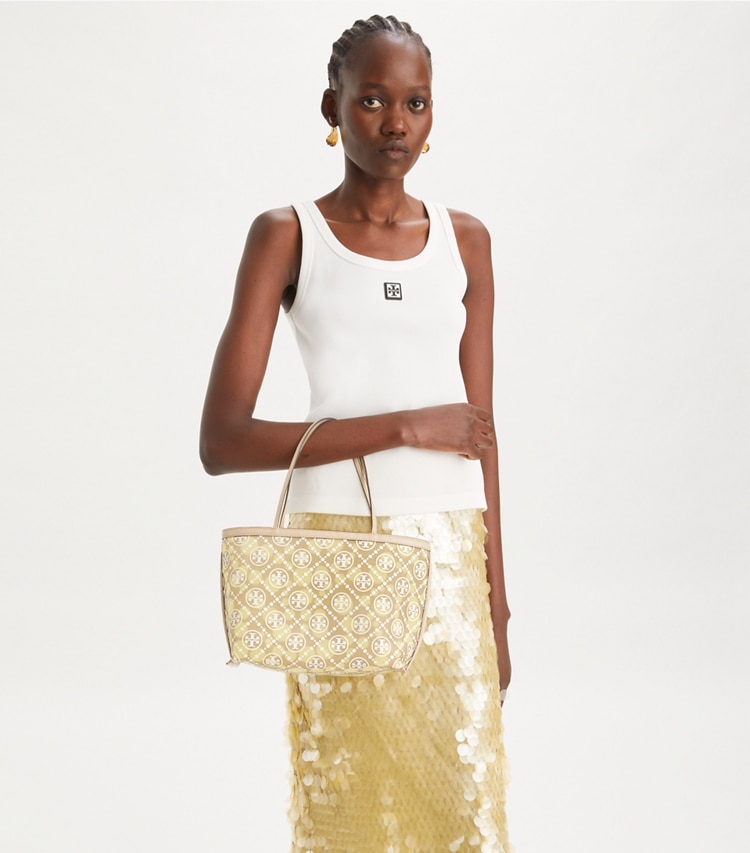 Tory Burch designer tote bags T Monogram Mesh Dot Tote in Khaki / Honeydew accessory on model