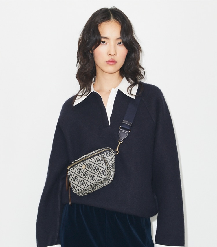 Tory Burch designer belt bags T Monogram Mini Belt Bag in Tory Navy accessory on model