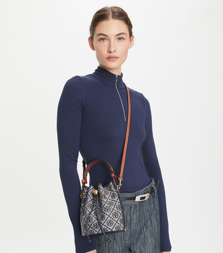 Tory Burch designer crossbody bags T Monogram Mini Bucket Bag in Tory Navy accessory on model