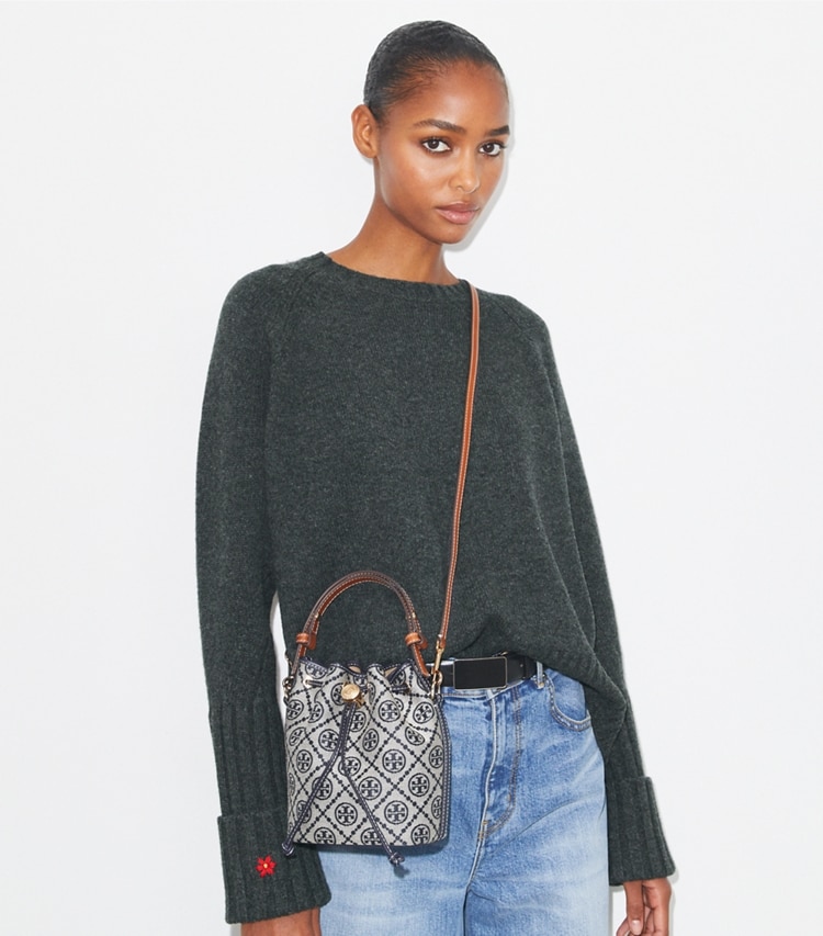 Tory Burch designer crossbody bags T Monogram Mini Bucket Bag in Tory Navy accessory on model