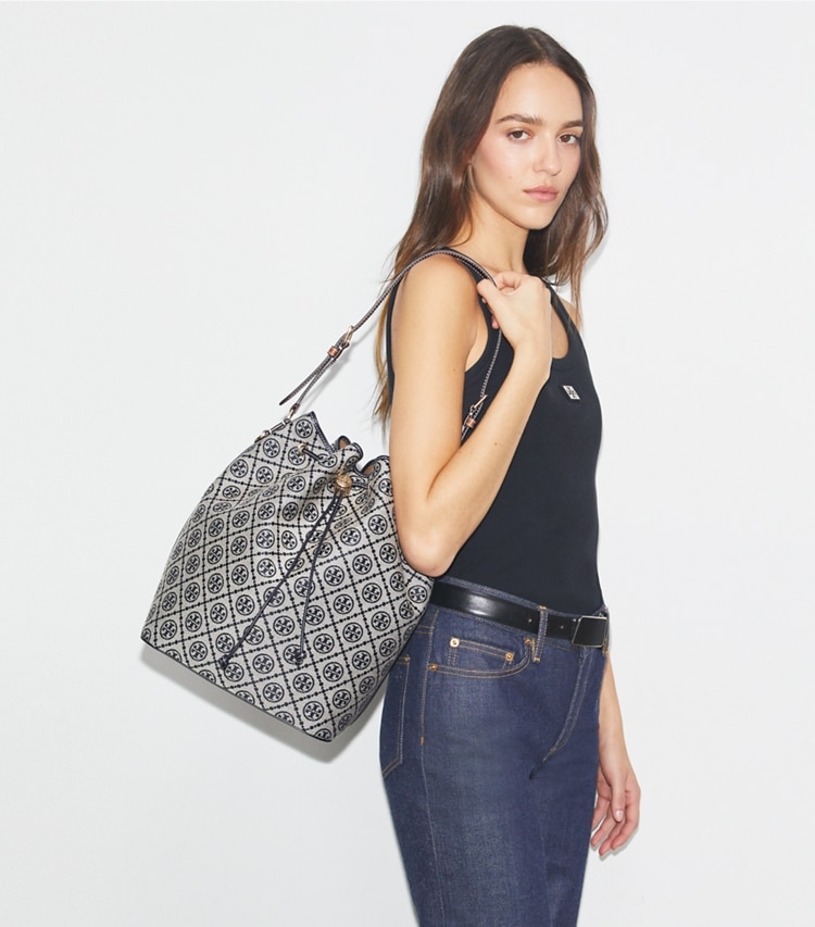 Tory Burch designer hobo bags T Monogram Oversized Bucket Bag in Tory Navy accessory on model