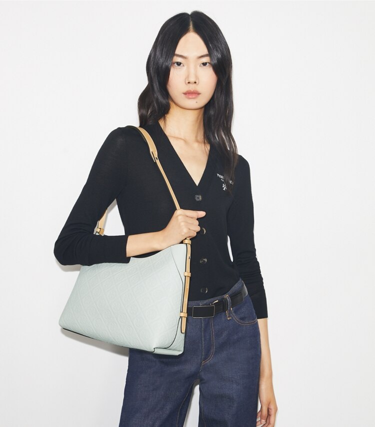 Tory Burch designer shoulder bags T Monogram Pebble Messenger in Light Titanium accessory on model