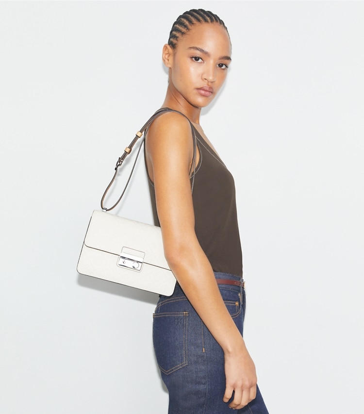 Tory Burch designer shoulder bags T Monogram Pebble Shoulder Bag in Warm White accessory on model