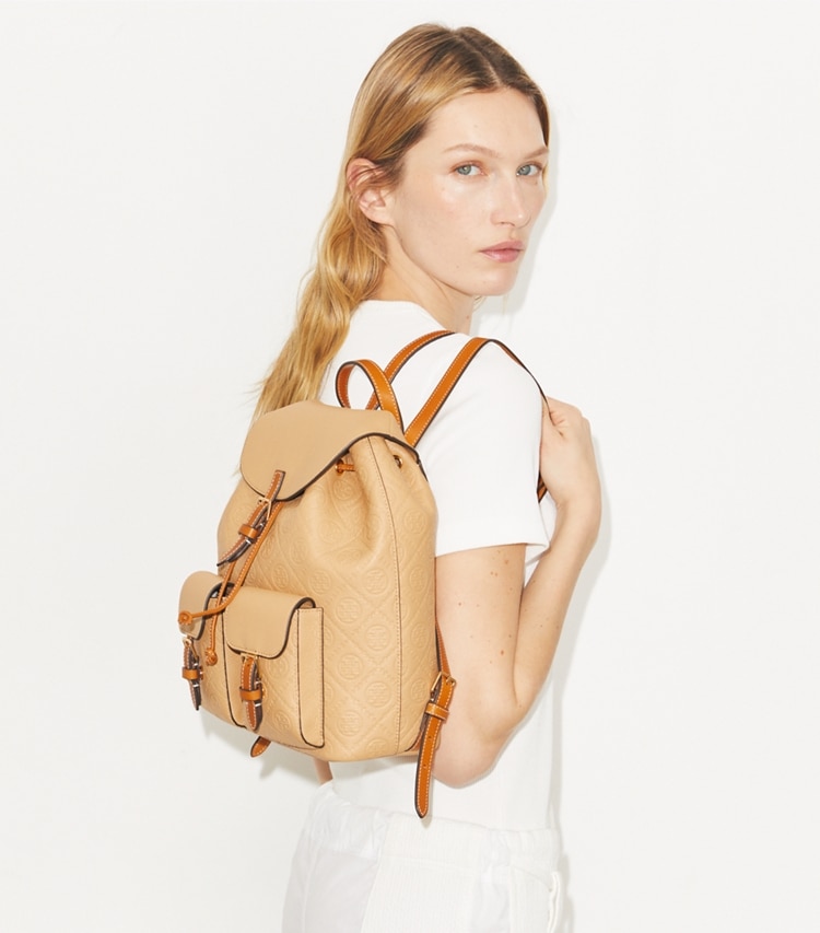 Tory Burch designer backpacks T Monogram Pebbled Backpack in Biscotti accessory on model