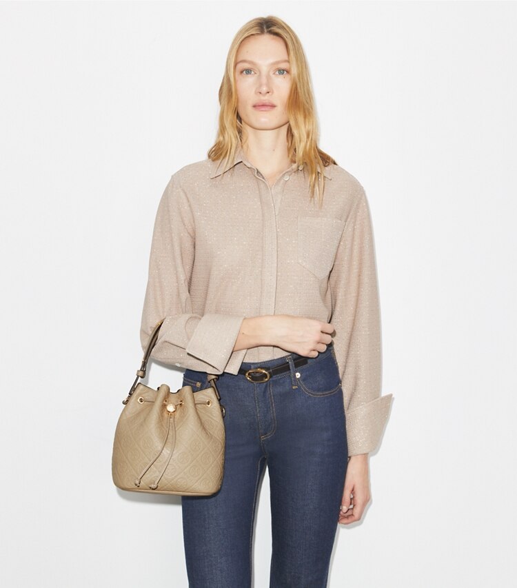 Tory Burch designer crossbody bags T Monogram Pebbled Bucket Bag in Fresh Clay additional on model