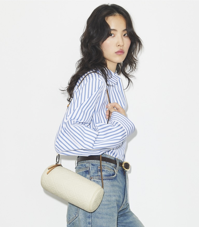 Tory Burch designer クロスボディバッグ Tモノグラム ペブルド シリンダーバッグ in Warm White angle