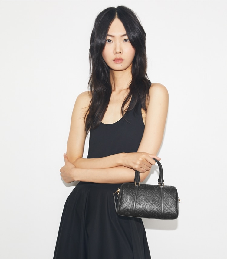 Tory Burch designer crossbody bags T Monogram Pebbled Petite Barrel Bag in Black additional on model