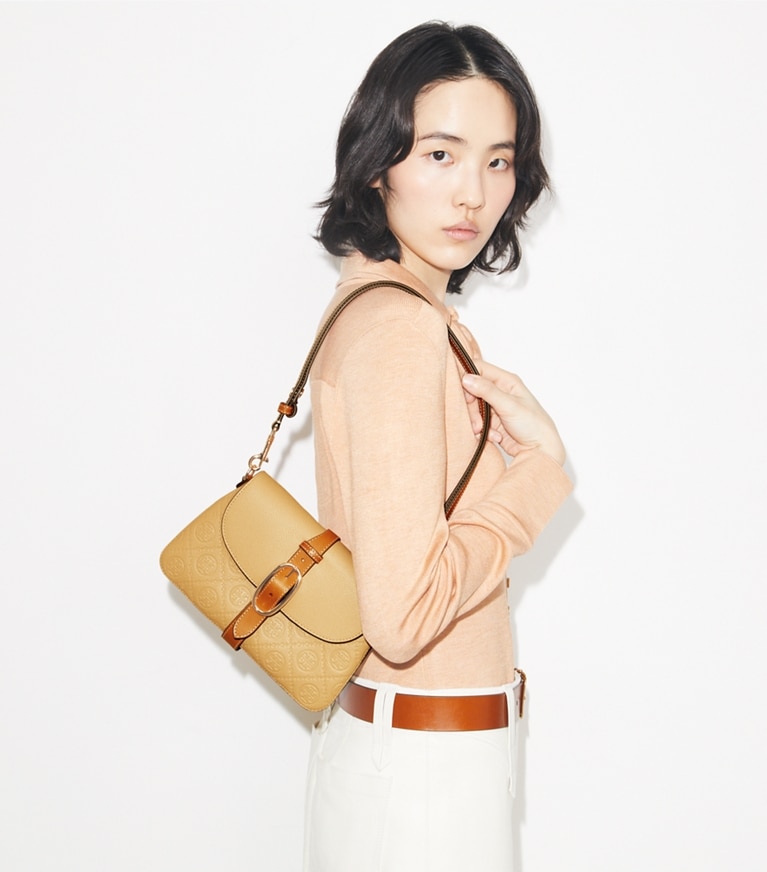 Tory Burch designer shoulder bags T Monogram Pebbled Soft Small Shoulder Bag in Biscotti accessory on model
