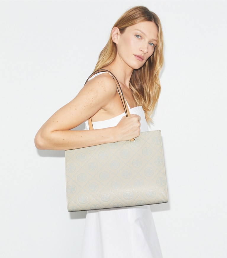 Tory Burch designer tote bags T Monogram Pebbled Tote in Light Titanium accessory on model