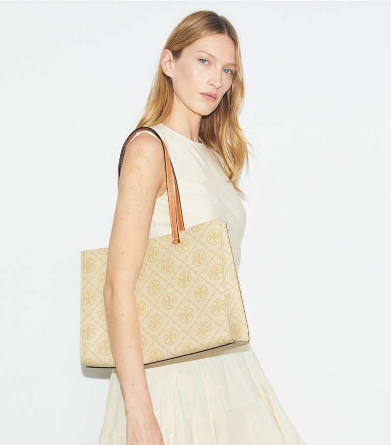 Tory Burch designer tote bags T Monogram Pebbled Tote in Biscotti accessory on model