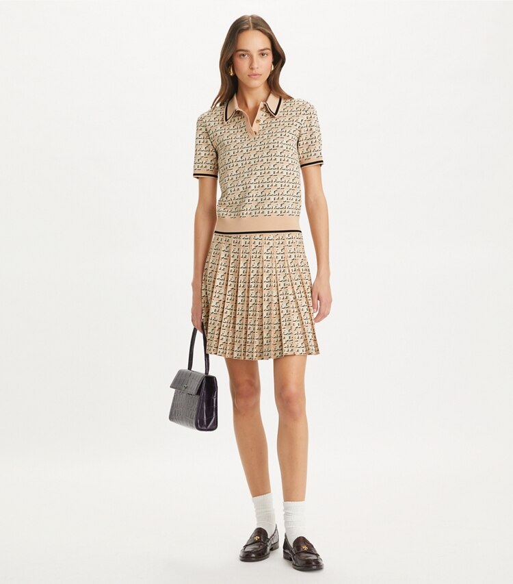 Tory Burch designer bottoms T Monogram Pleated Viscose Skirt in Apricot Blush T Logo Drop Shadow on model front