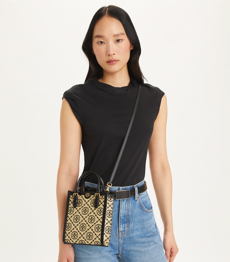 Tory Burch designer crossbody bags T Monogram Raffia Mini Tote in Black accessory on model