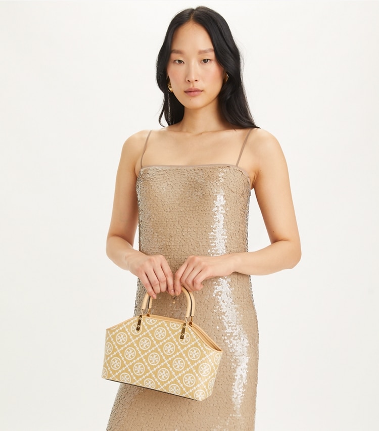 Tory Burch designer tote bags T Monogram Raffia Small Basket Tote in Natural accessory on model