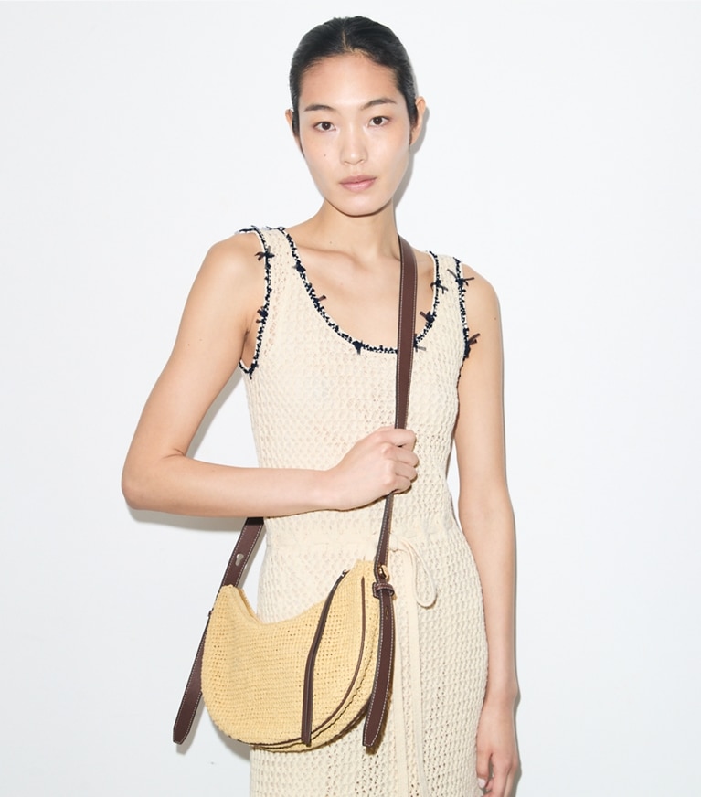Tory Burch designer shoulder bags T Monogram Romy Woven Half Moon Bag in Natural accessory on model