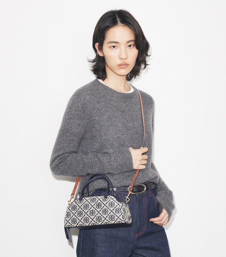 Tory Burch designer crossbody bags T Monogram Small Bowler in Tory Navy accessory on model