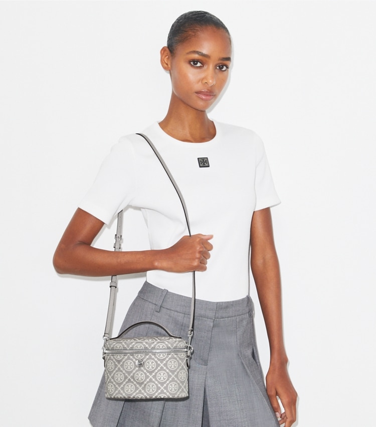 Tory Burch designer mini bags T Monogram Soft Vanity Case in Gray accessory on model