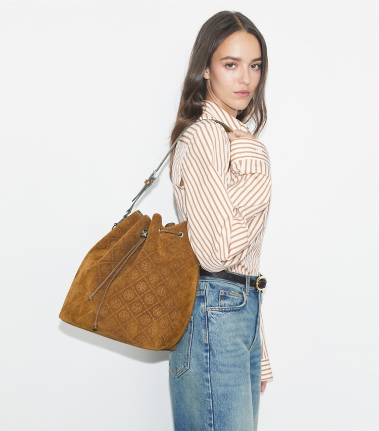 Tory Burch designer hobo bags T Monogram Suede Oversized Bucket Bag in CHICORY BROWN accessory on model