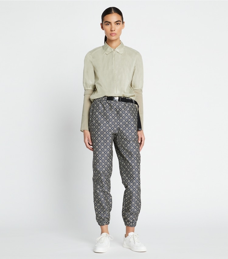 Tory Sport designer bottoms T Monogram Tech Jacquard Jogger in TORY NAVY T MONOGRAM SMALL SPORT on model front