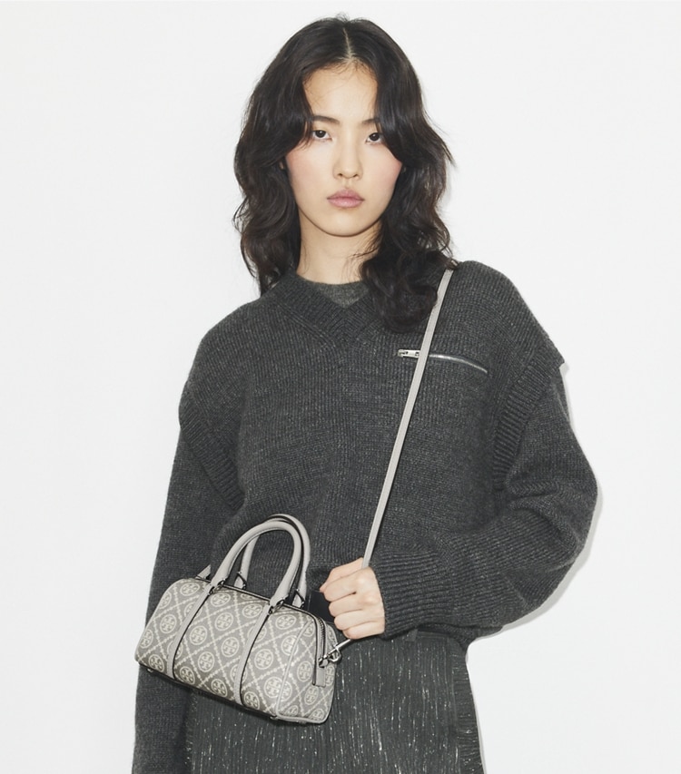 Tory Burch designer crossbody bags T Monogram Utility Mini Barrel Bag in Gray accessory on model