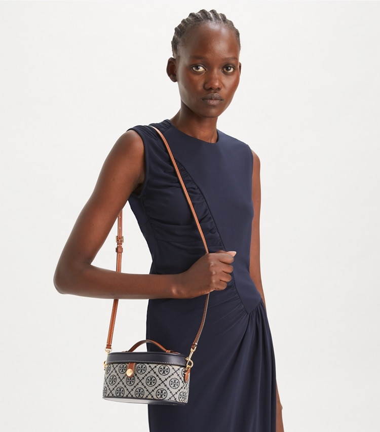 Tory Burch designer mini bags T Monogram Vanity Case in Tory Navy accessory on model